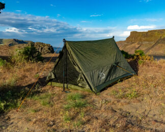 River country products trekker 2 trekking pole tent backpacking tent set up next to river