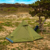 River country products trekker 1 trekking pole tent backpacking tent set up next to river with backpack