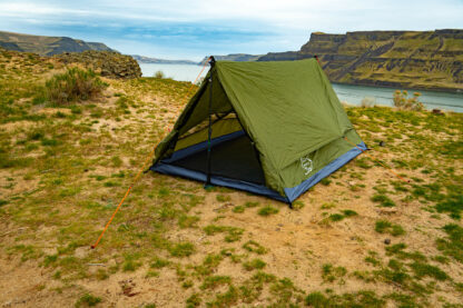 River country products trekker 2.2 trekking pole tent backpacking tent set up next to river with sleeping pads