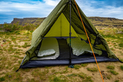 River country products trekker 2.2 trekking pole tent backpacking tent set up next to river with sleeping pads