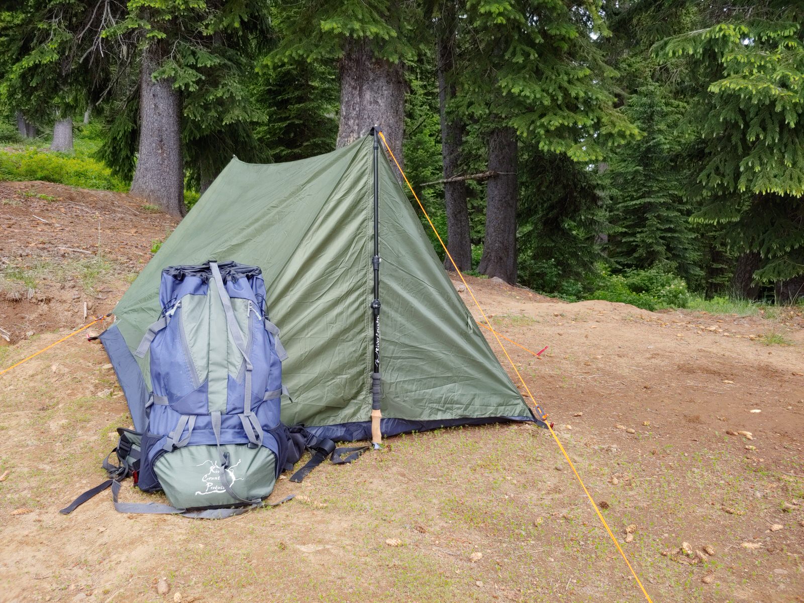 backpack and trekking pole tent