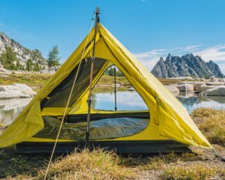 backpacking trekking pole tent outer shell set up near water