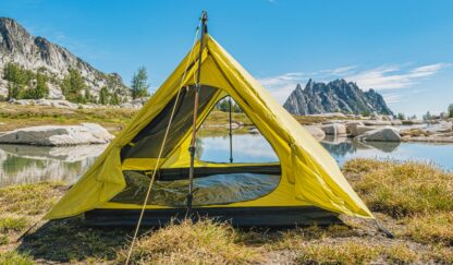 backpacking trekking pole tent outer shell set up near water