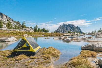 backpacking trekking pole tent outer shell set up near water