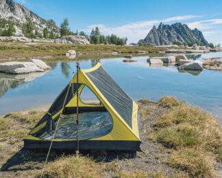 backpacking trekking pole tent set up near water