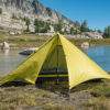 backpacking trekking pole tent set up near water