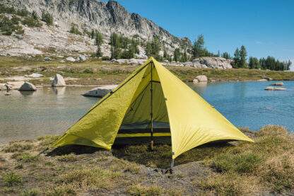 backpacking trekking pole tent set up near water