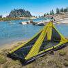 backpacking trekking pole tent set up near water