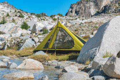 backpacking trekking pole tent set up near water